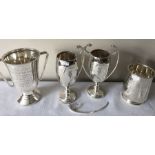 Four silver golf trophies, 1 handle off, inscribed to front. 708.9gms.
