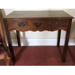 An 18thC mahogany side table, single drawer to front on square legs with shaped frieze. 87 x 47 x