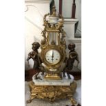 A decorative Italian marble & brass mantle clock.