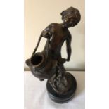 A bronze figure, 28cms h, a boy with a basket signed indistinctly to back.