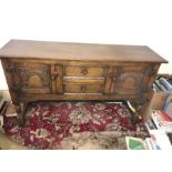 A good quality oak sideboard with 2 central drawers flanked by 2 cupboards. 145 w x 43d x 83cms.