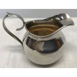 Small hallmarked silver jug, 7cms h. Birmingham 1916/17. 50gms. Condition ReportThree small dents to