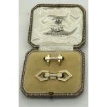 A pair of 9ct gold cufflinks set with black stones in original fitted box. Rood Burlington Arcade,