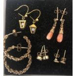 Five pairs of 9 ct gold mounted earrings to include coral and pearl. 8.5gms total.