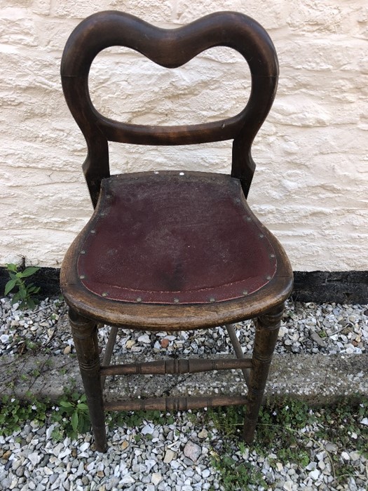 A 19thC high chair with balloon back.