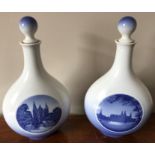 Pair of Royal Copenhagen pottery decanter bottles, Rosenborg and Frederiksborg Castles. 25cms h.