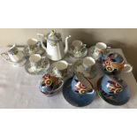 A bell china coffee service, coffee pot, six cups and saucers (1 a/f), milk and sugar with a bowl,