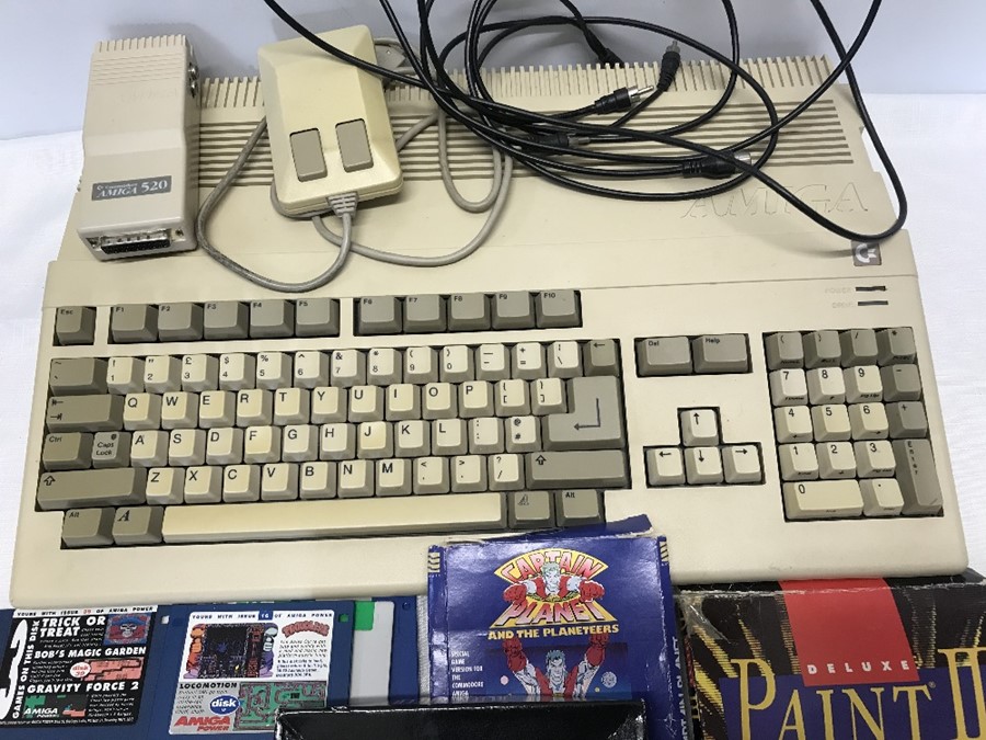 Commodore Amiga a500 with pad, leads and assorted games, Alien Breed, Captain Planet, Simpsons, - Image 2 of 3