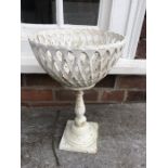 A cast iron basket on stand. 38cms h.