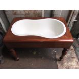 A Victorian mahogany baby bath with original pot. 64 x 40cms. Condition ReportTop in need of polish.