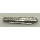 A silver penknife with foliate scroll engraving, a vacant cartouche, maker Hilliard and Thomason,
