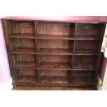 A 19thC mahogany bookcase with reeded sides and bun feet. 138 x 24 d x 111cms h.