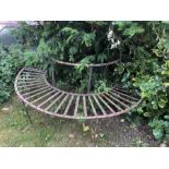 A 19thC cast iron tree seat, lacking one back support. Seat depth 36cms. Width between uprights