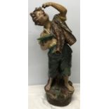 Large chalk figurine, Boy eating cherries. 69cms h. Condition ReportSome paint chips.