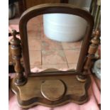 A 19thC mahogany dressing table mirror with lidded compartment to front.