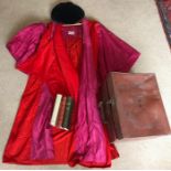 An academic cap, gown and cape with an original leather box belonging to the eminent psychiatrist Dr