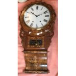 A 19thC American drop dial wall clock, Walnut with floral inlay. 83 h x 44 cms w.