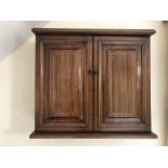 An inlaid mahogany 2 door wall hanging cabinet.