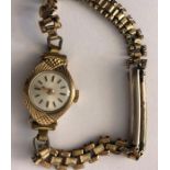 A 9 carat gold cased ladies wristwatch on plated bracelet, 11.6gms total.