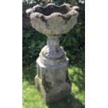 A reconstituted stone planter on octagonal pedestal. 97 h x 49cms d.