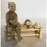 Japanese Meiji period ivory figure, Man with Boy. 9.5cms h, 10cms w. Condition ReportChip to toy car