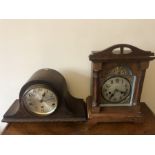 Oak cased mantle clock 37 x 26cms, brass cherub face with an oak cased napoleon hat mantle clock.