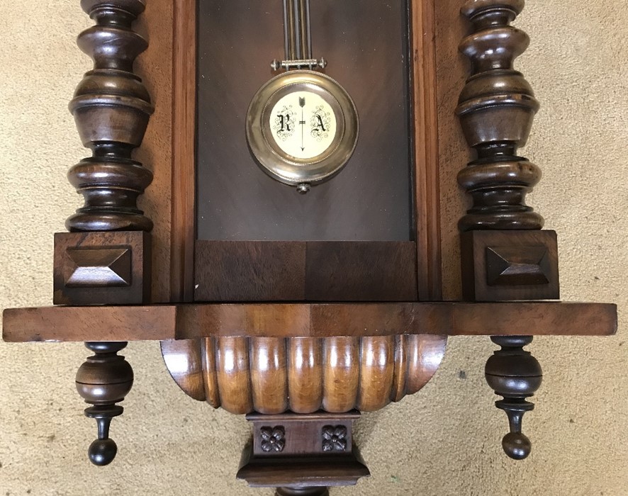 Walnut cased pendulum wall clock. DRGM movement. 100cms h x 41cms w with key. Condition - Image 2 of 3