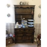 An oak Old Charm dresser display shelf over 2 drawers and two cupboards. 173 h x 91 w x 43cms d.