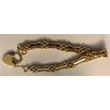 A 9 ct gold gate bracelet with padlock fastening. 14.2gms.