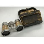 Cased mother of pearl opera glasses.