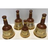 Wade Bells Whiskey decanters. 4 x 26cms h, 1 x 20cms h.Condition ReportOne with light gilt rub