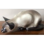 A Winstanley pottery Siamese cat, 41cms l, base painted KENSINGTON 45 Designed I. Winstanley.