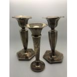 A pair of silver candlesticks, Chester 1924 with removable sconces, 1 slightly a/f. 12.5cms together