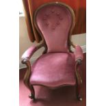 A 19thC mahogany upholstered open armchair.