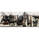 A quantity of African carved wooden and stone figures and animals.