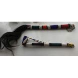 African beadwork whip with horse tail and beadwork covered pipe.