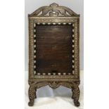 African carved wood, ebony and bone inlaid toilet mirror with tambour front. 64 h x 32cms w.
