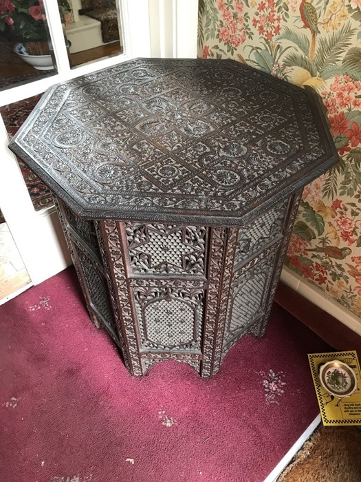 A vintage folding hardwood table. 68 d x 71cms h.