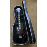 Hohner Blackwidow electric guitar with strap and lead in a Hiscox liteflite hard travel case.