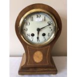 An Edwardian inlaid mantle clock. 17 w x 30cms h.
