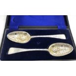 A pair of hallmarked silver berry spoons, Peter and Ann Bateman, Edingburgh 1785 and London 1799.