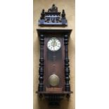Large pendulum wall clock, porcelain dial with brass decoration. 137cms h including pediment.