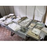 A boxed lot of mainly unused linen and embroidery cloths etc.