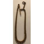 A 9 carat gold pocket watch chain with T bar. 32.7gms. 32cms l.