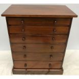A rosewood miniature chest of drawers/collectors cabinet. 46 h x 37 w x 23cms d.