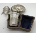 A continental white metal snuffbox with tavern scene depicted to front. 8 x 6cms together with
