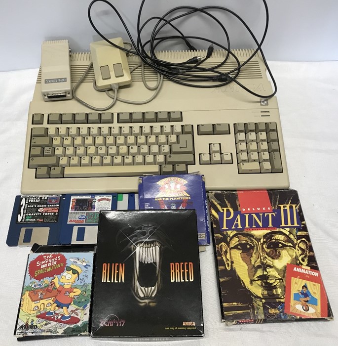 Commodore Amiga a500 with pad, leads and assorted games, Alien Breed, Captain Planet, Simpsons,