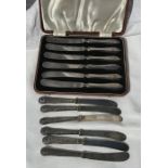 Cased set of silver handled knives, M and W, Sheffield 1915 together with a set of silver handle
