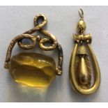 An unmarked yellow metal pendant drop and a 19thC fob with yellow stone to base. 9.6gms total.