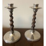 A pair of silver and oak barley twist candlesticks, 15cms h, Birmingham 1921, A.E. Jones.Condition